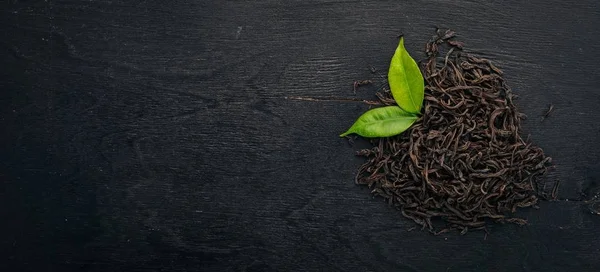 Suchej Czarnej Herbaty Tle Drewnianych Widok Góry Miejsce — Zdjęcie stockowe