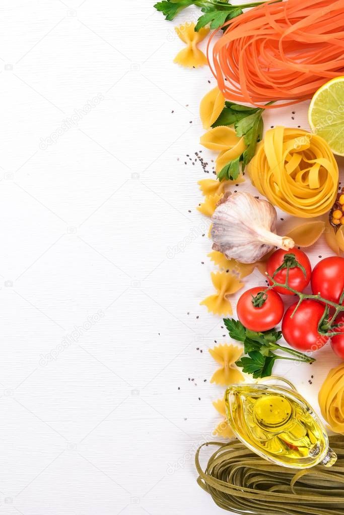 Set of pasta, noodles, spaghetti. Italian cooking, fresh vegetables and spices. On a white background. Top view. Copy space.