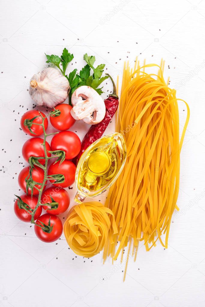 Dry Pasta on a wooden background. Italian Traditional Cuisine. Top view. Copy space.