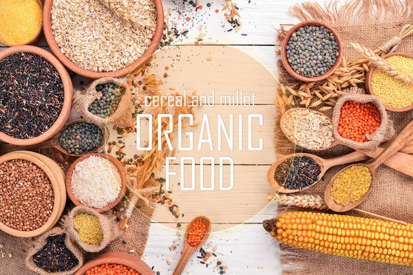 Cereal and millet. Organic food. Buckwheat, lentils, rice, millet, barley, corn, black rice. Top view. — Stock Image Cereal Millet Organic Food Buckwheat Lentils Rice Millet Barley Corn Stock Photo