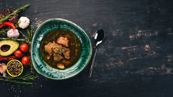 Beef and Vegetable Soup. Top view. On a black wooden background. Copy space. — Stock Image Beef Vegetable Soup Top View Black Wooden Background Copy Space Stock Picture