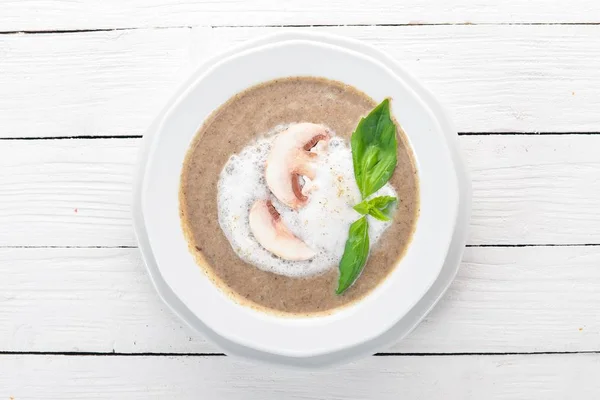 Mashed mushroom soup. On a wooden background. Top view. Copy space. — Stock Image Mashed Mushroom Soup Wooden Background Top View Copy Space Stock Photo