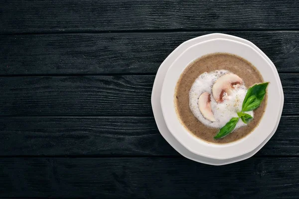 Mashed mushroom soup. On a wooden background. Top view. Copy space. — Stock Image Mashed Mushroom Soup Wooden Background Top View Copy Space Stock Photo