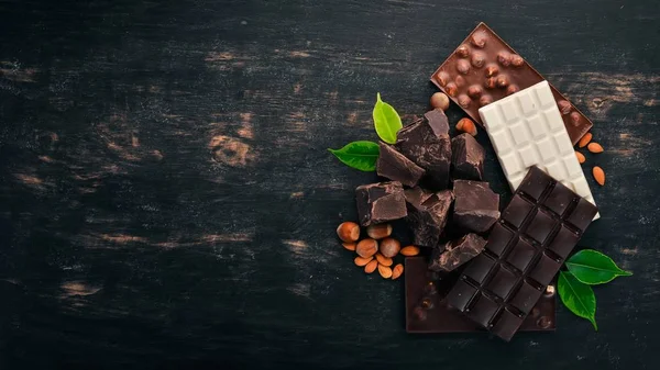 Set Milk Chocolate Black Chocolate Hazelnuts Black Wooden Background Copy — Stock Photo, Image