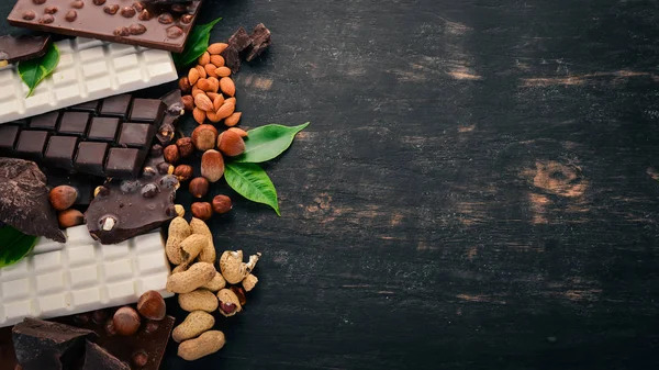 Set Chocolate Nuts Cookies Cocoa Black Wooden Background Top View — Stock Photo, Image