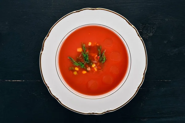 Tomato soup with chili and vegetables. Healthy food. On a black wooden background. Top view. Copy space for your text. — Stock Image Tomato Soup Chili Vegetables Healthy Food Black Wooden Background Top Stock Image