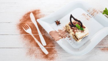 Tatlı Tiramisu. Ahşap bir arka plan üzerinde. Üstten Görünüm. Kopya alanı.