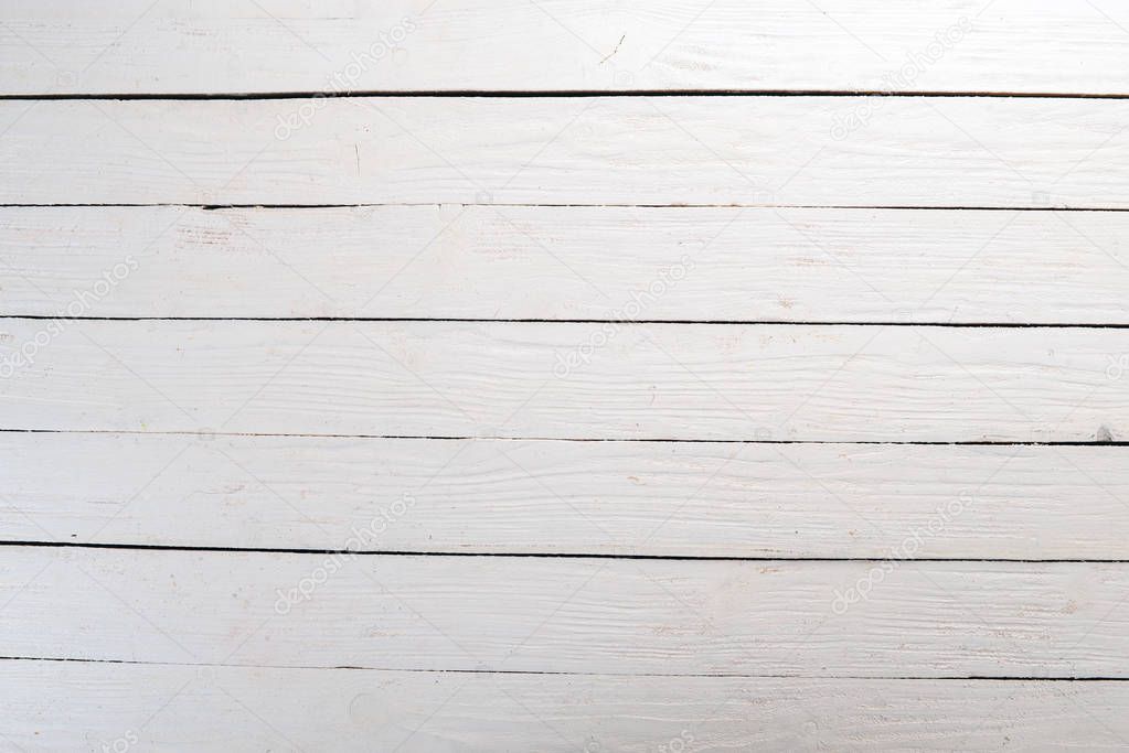 White textured wooden background.