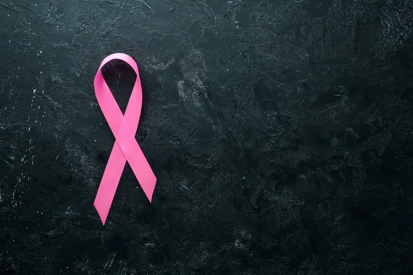 World cancer day: Breast Cancer Awareness Ribbon. Top view. Free copy space.