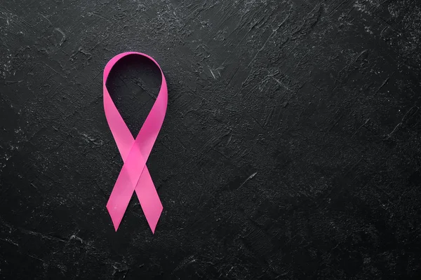 World cancer day: Breast Cancer Awareness Ribbon. Top view. Free copy space.