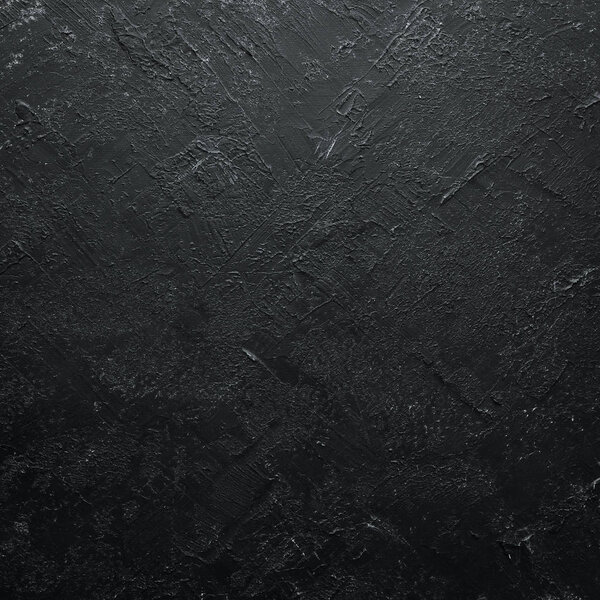 Black stone background. Top view. Free copy space.