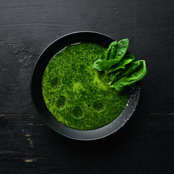 Spinach soup. Healthy food. Top view. Free space for your text.
