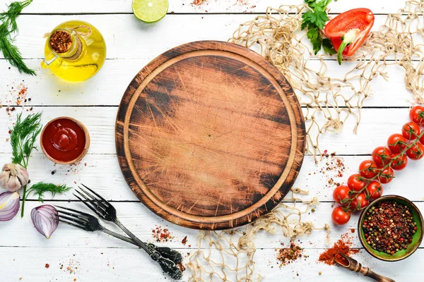 Food banner. Spices, vegetables and herbs on a white wooden background. Top view. free space for your text. Rustic style.