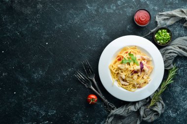 Pasta with chicken meat and cheese. Italian cuisine. Top view. Free space for your text.