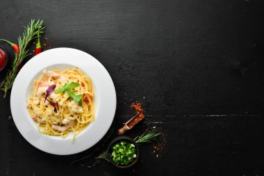 Pasta with chicken meat and cheese. Italian cuisine. Top view. Free space for your text.