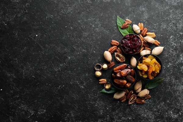 Set Nuts Dried Fruits Berries Black Stone Background Top View — Stock Photo, Image