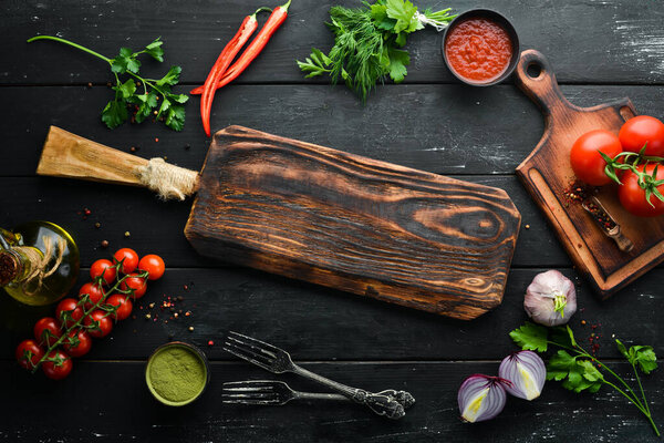 Black banner. Background of cooking, spices and vegetables. Top view. Free space for your text.