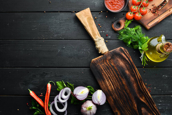 Black banner. Background of cooking, spices and vegetables. Top view. Free space for your text.