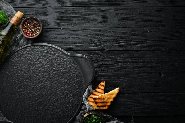 Black stone banner of food, vegetables and spices. Background of cooking.