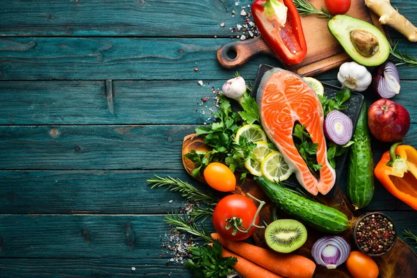 Healthy food menu: fish meat, vegetables and fruits. Diet menu.