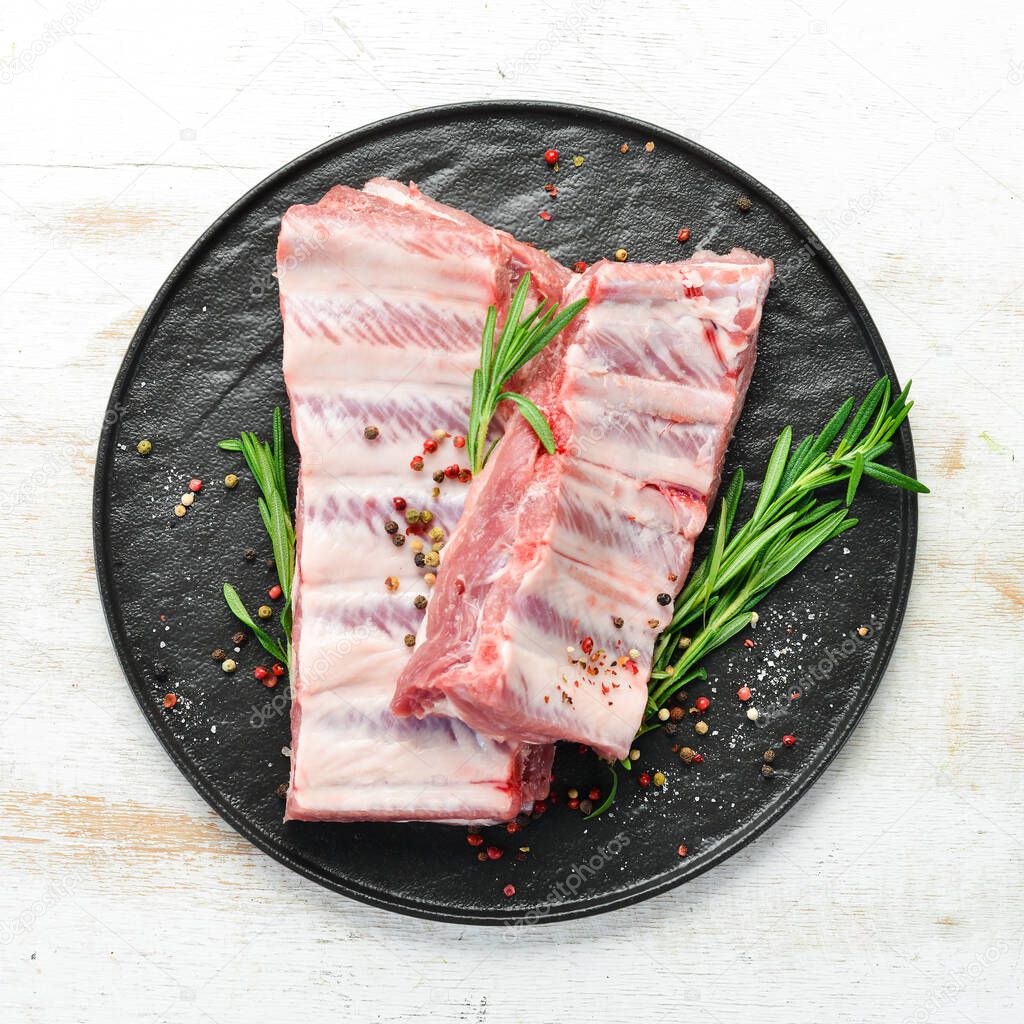 Raw pork ribs with spices. Meat. Top view. Free space for your text.