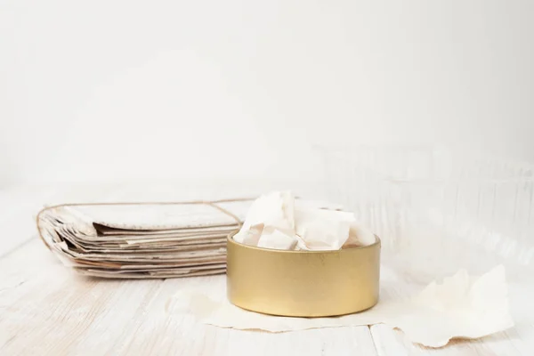 A bunch of old letters, torn paper, plastic container, iron pot — Stock Photo, Image