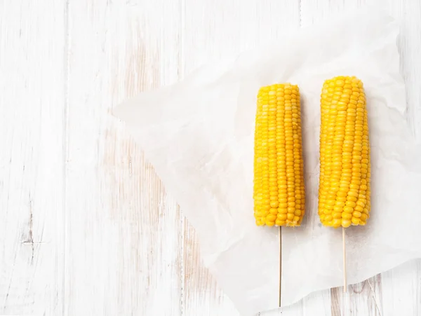 Two cob of boiled corn on white background — Stock Photo, Image