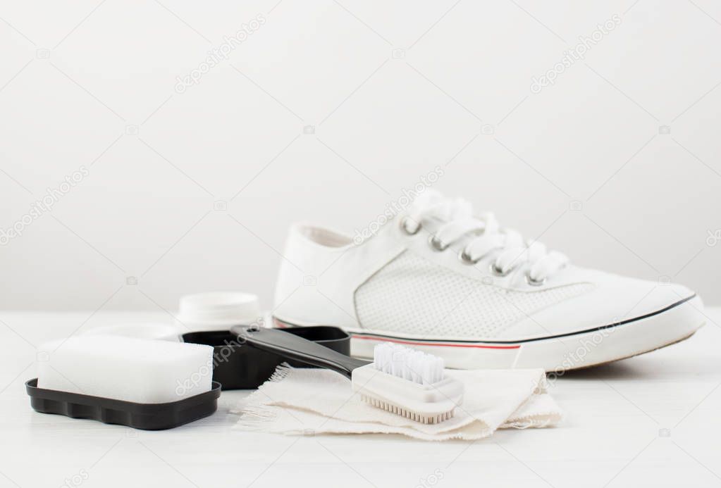 Brush, sponge and cream for white shoes