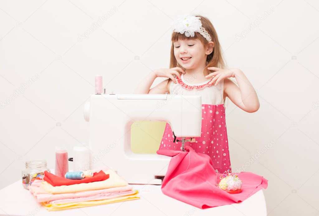 The girl is engaged in needlework using sewing machine