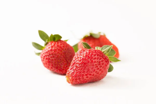 Ripe red strawberry on white table — Stock Photo, Image