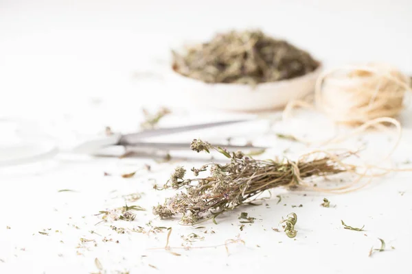 The dried herb thyme on a white table — Stock Photo, Image