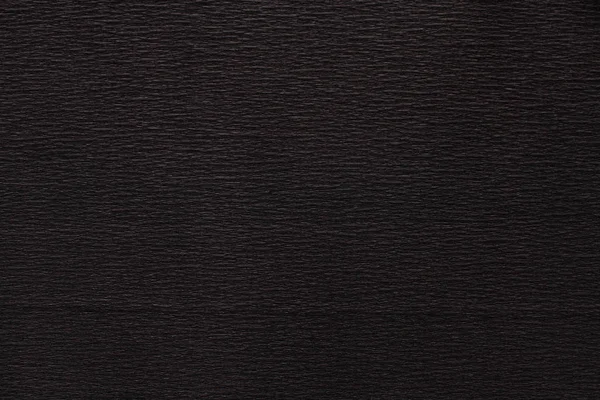 Koyu siyah kıvrımlı ince düz olmayan kağıt dokusu — Stok fotoğraf