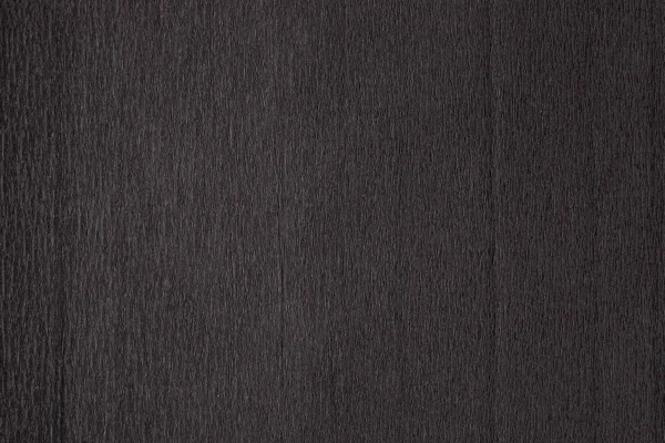 Текстура темно-черной гофрированной тонкой неровной бумаги — стоковое фото