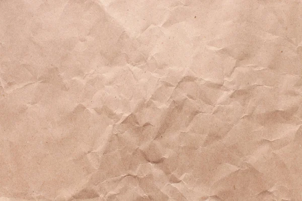 Texture of old rough recycled Kraft brown paper with creases — Stock Photo, Image