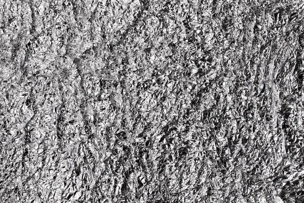 Achtergrond textuur van glanzend aluminiumfolie — Stockfoto