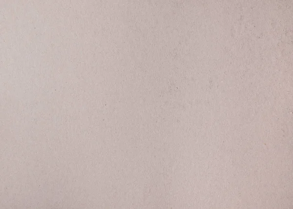 Текстура коричневого гофрированного картона с небольшими включениями — стоковое фото