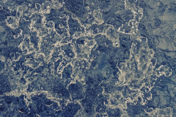 Kreatív absztrakt blue fagyasztott grunge háttér az olvadó jég felszíni blur. — Stock Fotó