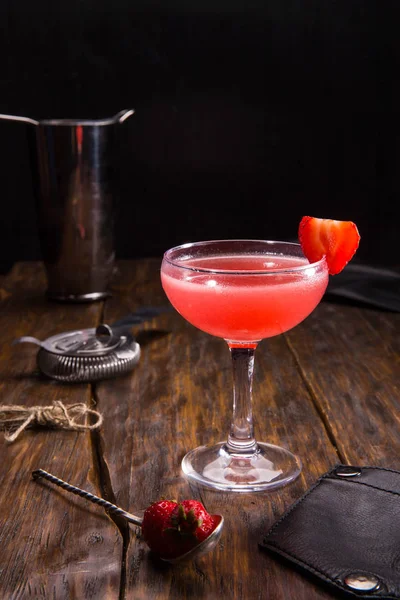 Cocktail with strawberry and gin in a cocktail glass