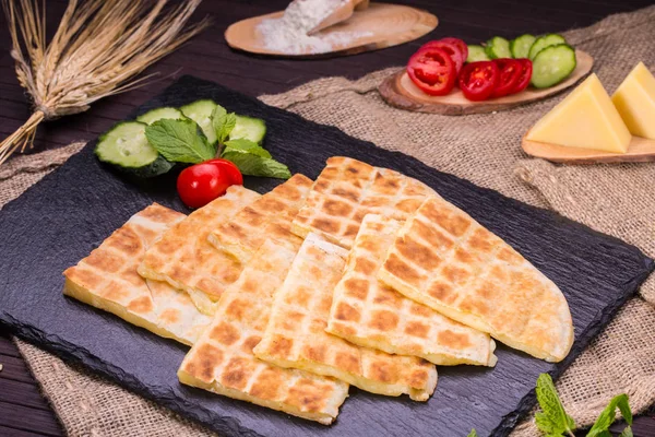 The Arab flat cake with cheese the Mozzarella roasted on coals — Stock Photo, Image