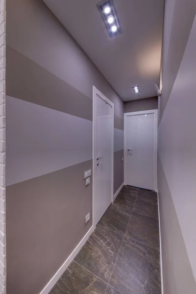 White doors in the light combined corridor