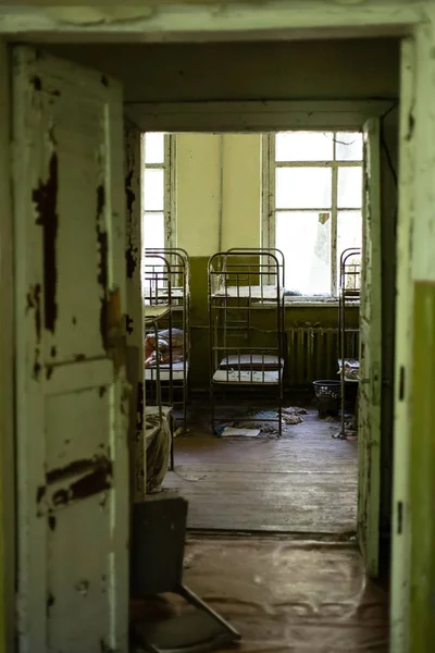 Bedroom in abandoned kindergarten — Stock Photo, Image