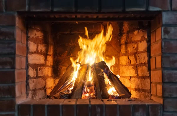 Firewood burning in a fireplace close-up - Stok İmaj
