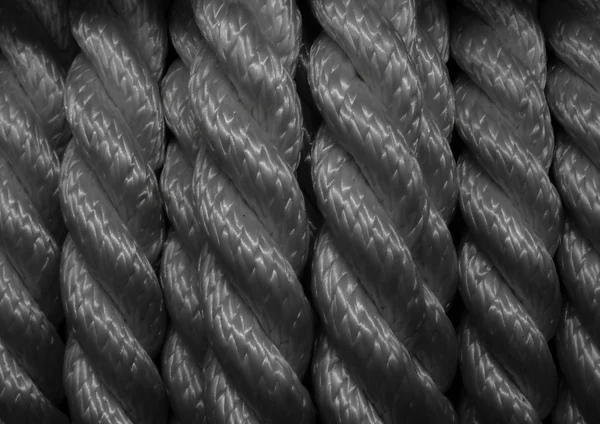 Скрученный композитный шнур на фоне текстуры — стоковое фото