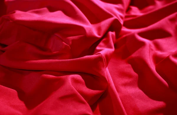 Bed linen shop. Wrinkles on the red silk vail detailed stock image — Stock Photo, Image