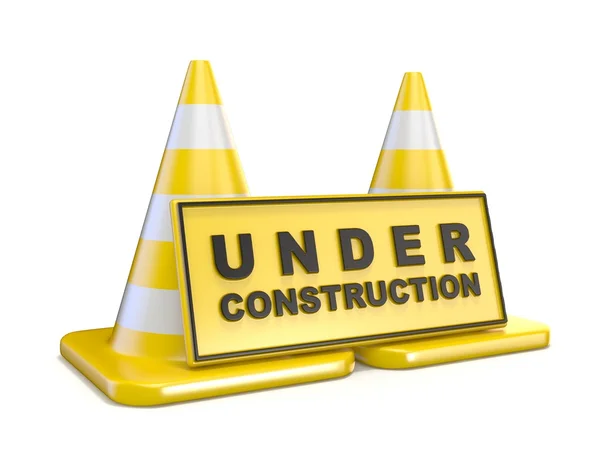 Yellow UNDER CONSTRUCTION sign and two road cones — Φωτογραφία Αρχείου