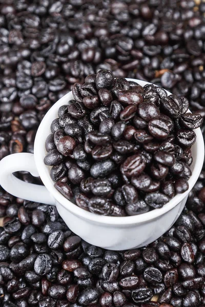 Coffee beans inside a cup