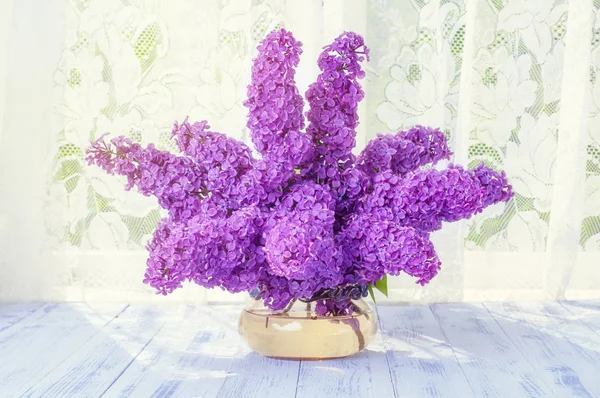Bouquet of lilacs sunlight vase — Stock Photo, Image