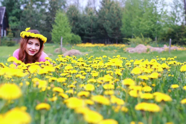 young woman on dandelion meadow