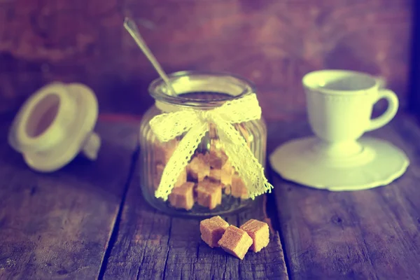 Toned photo tea cup with sugar cubes — Stock Photo, Image