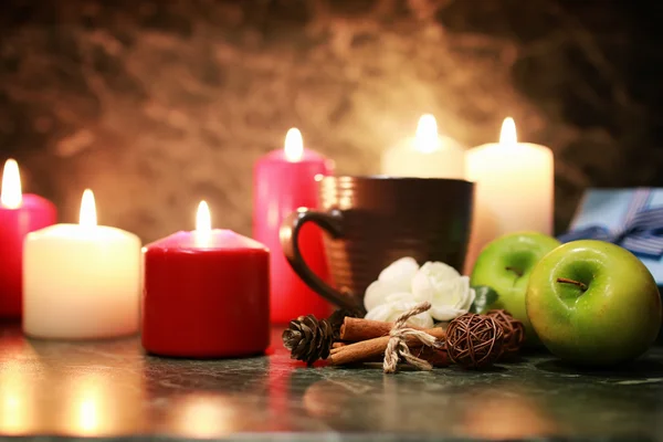 Night cup of tea with candle and apple — Stock Photo, Image